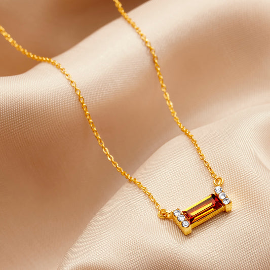 Topaz baguette cut birthstone necklace in gold 