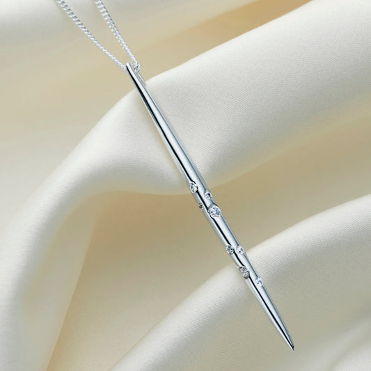 Sterling silver Sagittarius constellation necklace with a polished spike pendant set with Swarovski crystals, shown on an elegant silver chain.